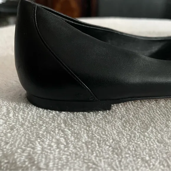 Louis Vuitton Black Flats with Gold Logo