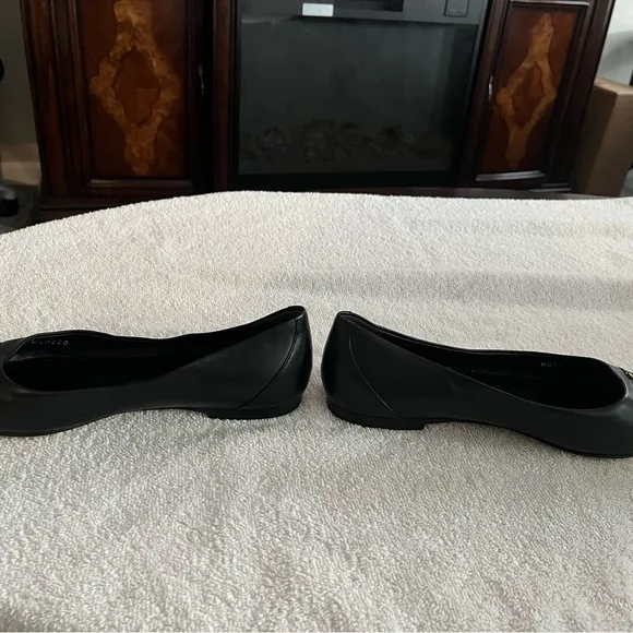 Louis Vuitton Black Flats with Gold Logo
