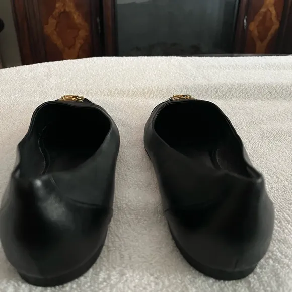 Louis Vuitton Black Flats with Gold Logo
