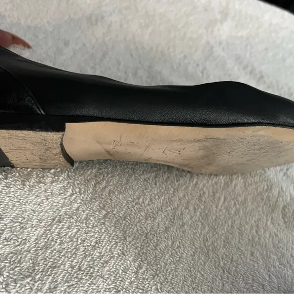 Louis Vuitton Black Flats with Gold Logo