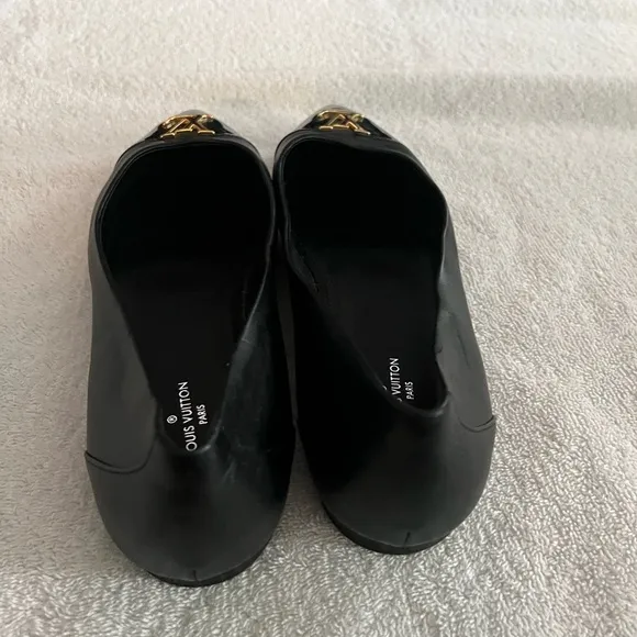 Louis Vuitton Black Flats with Gold Logo
