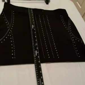 ROCK &amp; REPUBLIC size 12 black rhinestone studded mini skirt NWOT