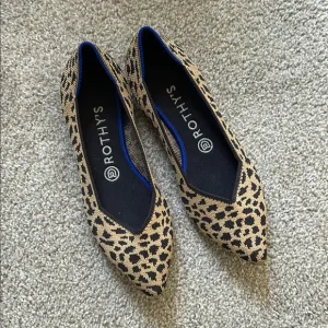 Rothy's Brown and Black Flats with Animal Print