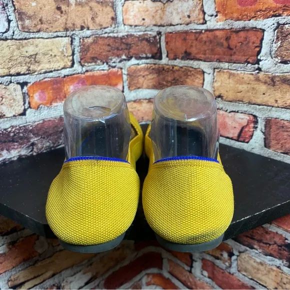 Rothy’s pointed yellow flats