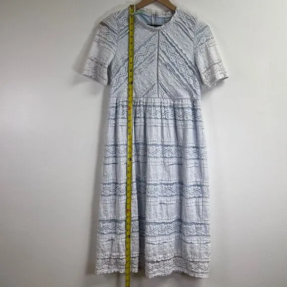 Saving Paige Floral lace short sleeved dress, sz small. Light blue white tiered