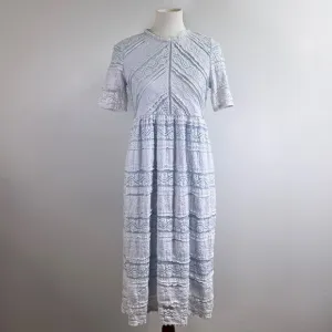 Saving Paige Floral lace short sleeved dress, sz small. Light blue white tiered