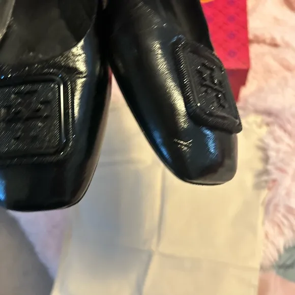 Tory Burch Black Flats with Embossed Logo and Glossy Finish