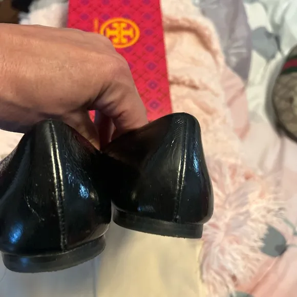 Tory Burch Black Flats with Embossed Logo and Glossy Finish