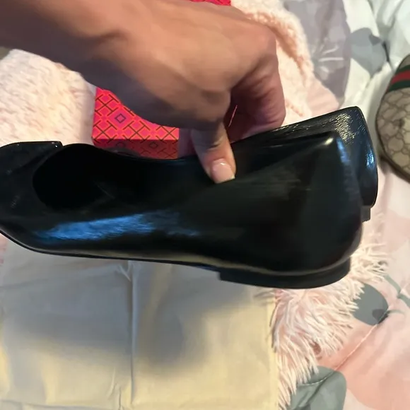 Tory Burch Black Flats with Embossed Logo and Glossy Finish