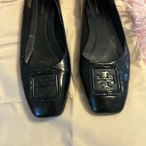 Tory Burch Black Flats with Embossed Logo and Glossy Finish