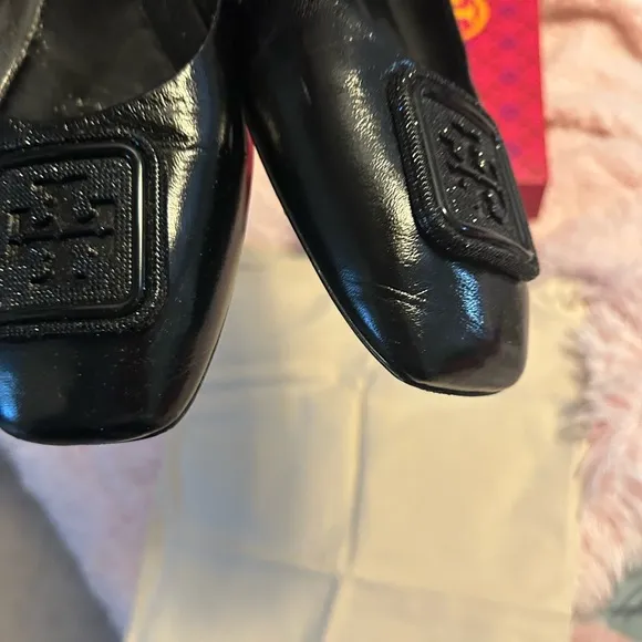 Tory Burch Black Flats with Embossed Logo and Glossy Finish