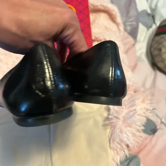 Tory Burch Black Flats with Embossed Logo and Glossy Finish