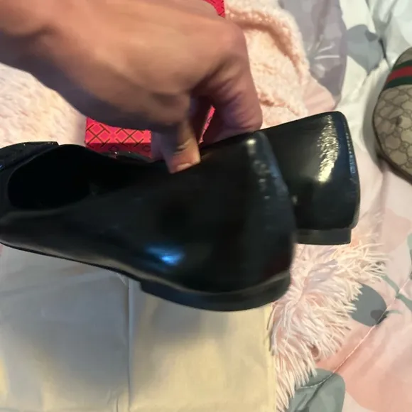 Tory Burch Black Flats with Embossed Logo and Glossy Finish